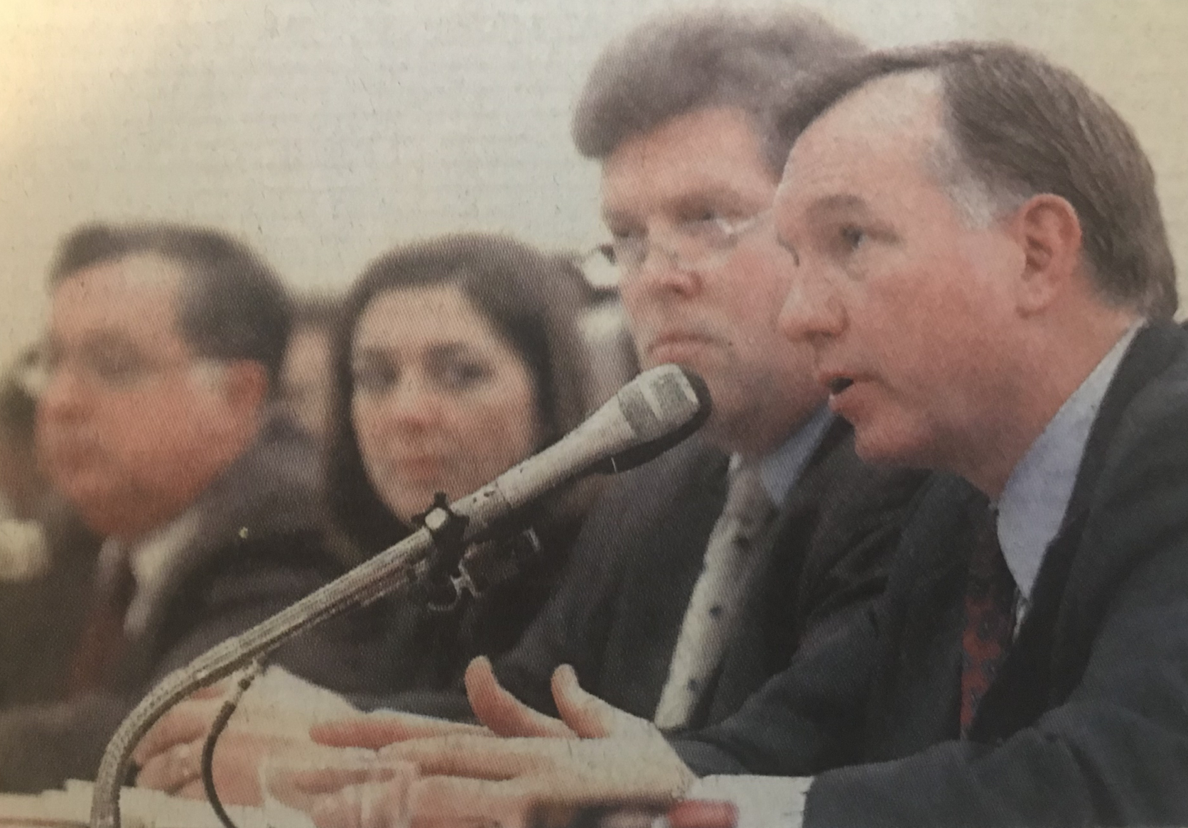 man speaking into microphone